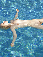Young girl Maya relaxing in the water - Erotic and nude pussy pics at GirlSoftcore.com