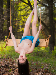 Hilary C playfully poses outdoors baring her slender body on the swing. - Erotic and nude pussy pics at GirlSoftcore.com