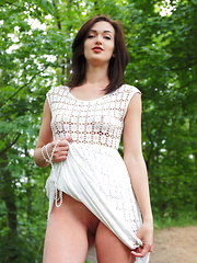 Lara D strips on the grass as she bares her sweet pussy. - Erotic and nude pussy pics at GirlSoftcore.com