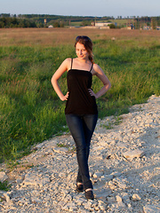 Nikia A flaunts her amazing, nubile body as she poses on the couch. - Erotic and nude pussy pics at GirlSoftcore.com