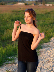 Nikia A flaunts her amazing, nubile body as she poses on the couch. - Erotic and nude pussy pics at GirlSoftcore.com