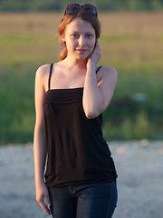 Nikia A flaunts her amazing, nubile body as she poses on the couch. - Erotic and nude pussy pics at GirlSoftcore.com