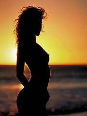 Monique Alexander looking amazing at sunset on the beach - Erotic and nude pussy pics at GirlSoftcore.com