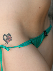 This itty bitty green bikini cannot contain all of Jessi June - Erotic and nude pussy pics at GirlSoftcore.com