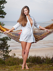 Elizabeth youthful yet alluring beauty stands out all over the grassy cliff overviewing the ocean as she sensually strips her light blue polo and poses elegantly on the hammock. - Erotic and nude pussy pics at GirlSoftcore.com