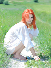 Surrounded by vast green grass, Violla\'s alluring beauty and charmingg allure stands out, with her pale smooth skin, fiery red hair, pink, perky boobs, and delectable labia. - Erotic and nude pussy pics at GirlSoftcore.com