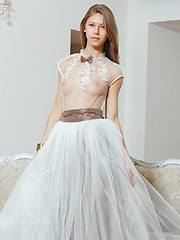 Katherine naughtily lifts her dress skirt to reveal her smooth, shaven labia, before getting naked on top of the sofa. - Erotic and nude pussy pics at GirlSoftcore.com