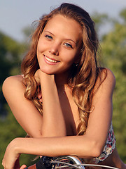 Mango exudes a pretty girl-next-door in her floral corset, skimpy pink skirt, and embellished sandals as she frolic on the grassy prairie with her bicycle. - Erotic and nude pussy pics at GirlSoftcore.com