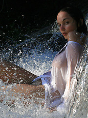 Super model Jenya is photographed dripping wet in the rain.