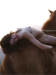 Riding in a strong horse is this brunette with kinky hair and alabaster skin. - Erotic and nude pussy pics at GirlSoftcore.com