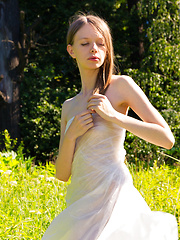 Gorgeous slim girl posing absolutely naked outdoor in the field on the plastic sheeting. - Erotic and nude pussy pics at GirlSoftcore.com