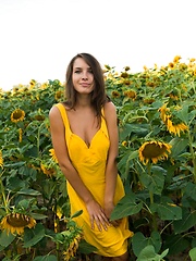 Semmi strips her yellow sexy dress and   dazzles us with her voluptuous body   with super smooth and fair skin, puffy large breasts, and her alluring blue eyes in the sunflower field. - Erotic and nude pussy pics at GirlSoftcore.com