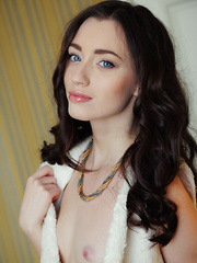 Sultry, seductive face framed by curled brown hair, a teasing smile, and lots of open, explicit poses that showcase Zsanett Tormay's slender build, smooth fair skin, and delicious pink pussy with puffy clit - Erotic and nude pussy pics at GirlSoftcore.com