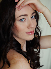 Sultry, seductive face framed by curled brown hair, a teasing smile, and lots of open, explicit poses that showcase Zsanett Tormay's slender build, smooth fair skin, and delicious pink pussy with puffy clit - Erotic and nude pussy pics at GirlSoftcore.com