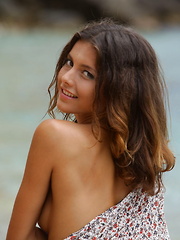 Divina A enjoys a nude stroll on the beach - Erotic and nude pussy pics at GirlSoftcore.com