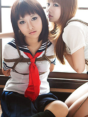 Dimdim Asian in uniform is tied in ropes by another sexy cupcake - Erotic and nude pussy pics at GirlSoftcore.com