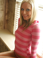 Petite teen babe Skye teases with her perky tits as she lifts her pink striped shirt - Erotic and nude pussy pics at GirlSoftcore.com