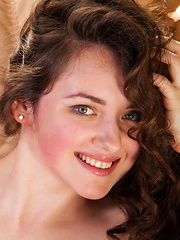 Conchita relaxes on the couch, naked and uninhinbited - Erotic and nude pussy pics at GirlSoftcore.com
