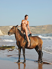 Suzanna A horse-back rides naked on the beach - Erotic and nude pussy pics at GirlSoftcore.com