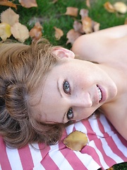 Sadie gets naked in the park - Erotic and nude pussy pics at GirlSoftcore.com