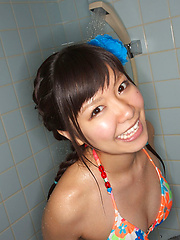 Sweet Ayana Tanigaki smiles and poses at the kitchen with banana - Erotic and nude pussy pics at GirlSoftcore.com