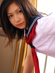 Kaori Ishii Asian is naughty and shows legs under uniform skirt - Erotic and nude pussy pics at GirlSoftcore.com