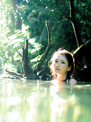 Neo Asian babe in white dress loves feeling her body in water - Erotic and nude pussy pics at GirlSoftcore.com