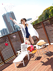 Kana Yuuki Asian in bath suit plays with umbrella in the balcony - Erotic and nude pussy pics at GirlSoftcore.com