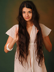 Connie's natural beauty with her seemingly innocent allure accentuated by her charming smile hypnotizes the viewer. But this angelic charmer can also tease as she starts showcasing her curvy body with even complexion and delicious pussy.