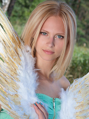 Amazing blonde teen babe gets naked on the lap of nature and tries to mimic some angelic beauty with her poses. - Erotic and nude pussy pics at GirlSoftcore.com