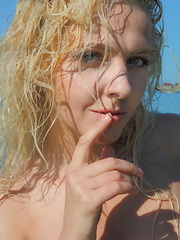 This petite blonde takes her hot beach outfit off piece by piece and you see more of her juiciness. - Erotic and nude pussy pics at GirlSoftcore.com