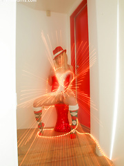 Kara in her sexy christmas outfit wrapped in lights spreading her pussy - Erotic and nude pussy pics at GirlSoftcore.com
