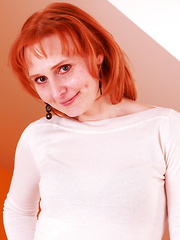 Horny red housewife playing with herself - Erotic and nude pussy pics at GirlSoftcore.com
