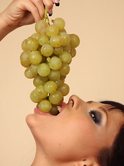 Domino masturbates with Grapes