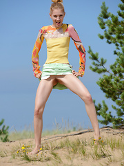 The hot sun burns her pale skin as she shows of her gorgeous form in some hot poses, while being naked and naughty. - Erotic and nude pussy pics at GirlSoftcore.com