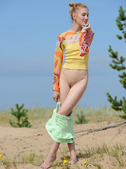 The hot sun burns her pale skin as she shows of her gorgeous form in some hot poses, while being naked and naughty. - Erotic and nude pussy pics at GirlSoftcore.com