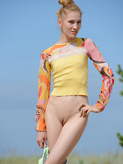 The hot sun burns her pale skin as she shows of her gorgeous form in some hot poses, while being naked and naughty. - Erotic and nude pussy pics at GirlSoftcore.com