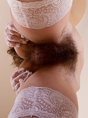 Young hairy cutie Gretta plays with her stockings - Erotic and nude pussy pics at GirlSoftcore.com