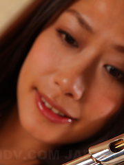 Slutty Yayoi Yanagida posing with her flute - Erotic and nude pussy pics at GirlSoftcore.com